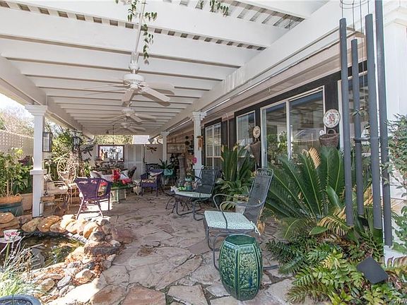 The 800 square foot rain-proof patio and arbor provide a tranquil setting.  The pond and fountain complete the serenity package.