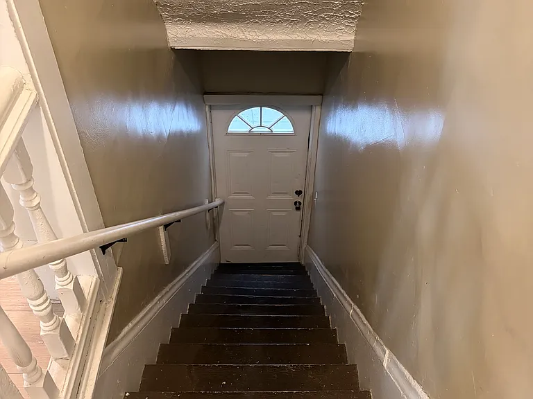 Stairs leading to door to go to back yard.