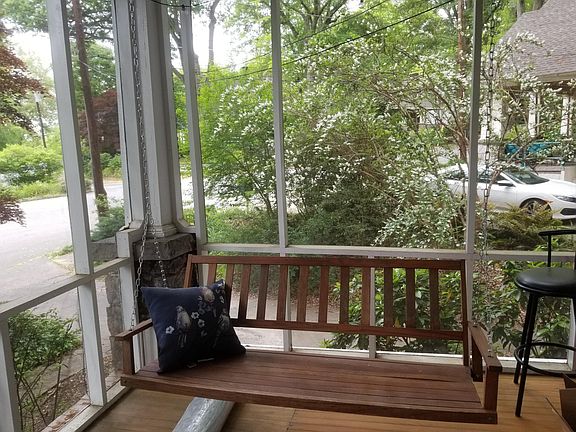 Entry front screened porch leads into Living Room and to Sunroom