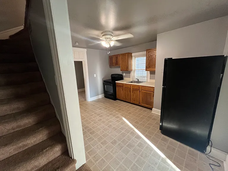 Kitchen, stairs up to the bedrooms.