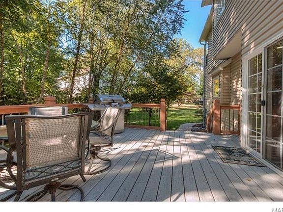 Lovely deck opens from the breakfast area and leads to the beautiful back grounds.