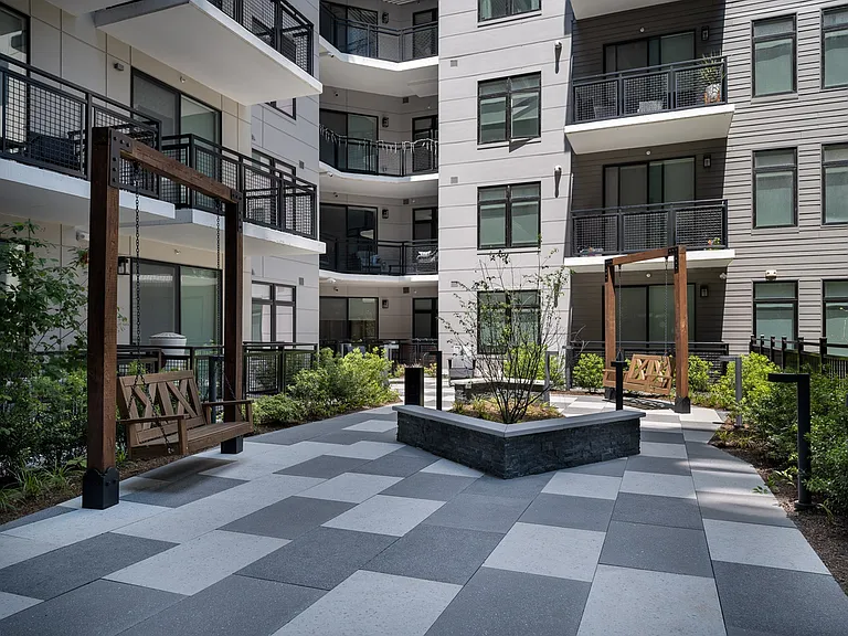 Stunning courtyard space with seating to enjoy the surrounding nature.