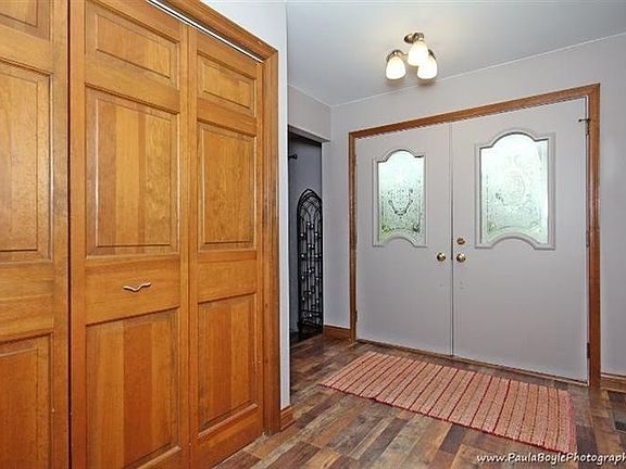 Double door entry with new wood floors.