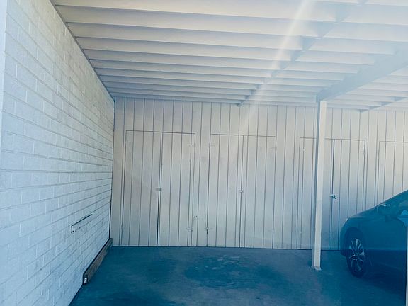 1-Car Covered Parking Carport with large room.