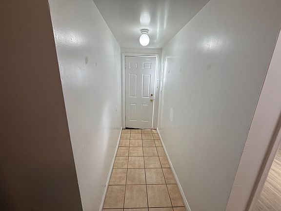 Entry - front room to the right, 3 bedrooms on the left, bathroom at end of hallway