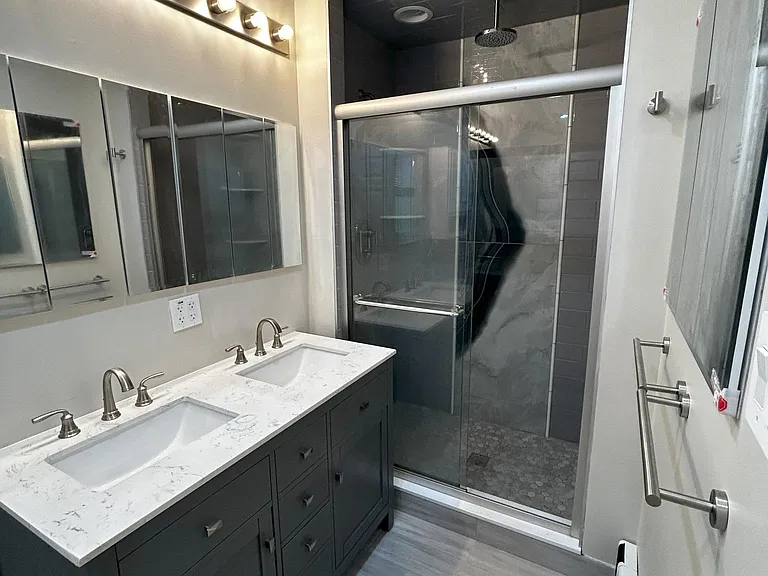 Duel sink vanity, 3 mirrored medicine cabinets built into wall