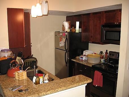 Kitchen with Cherry Cabinets, granite, stainless steel and more!