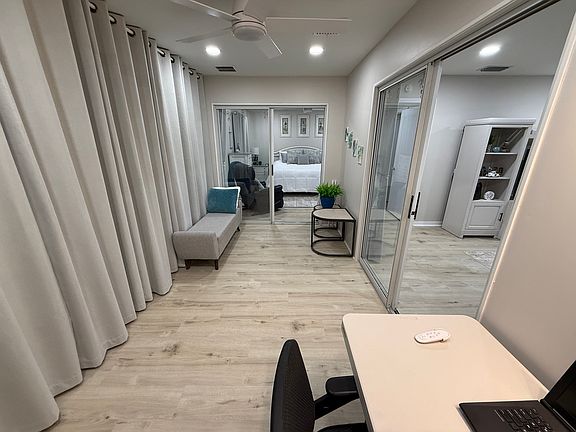 The Florida Room/Den is filled with windows and features 100% blackout curtains with magnetic tiebacks. If you need extra sleeping space, all furniture in this room fits in one corner to allow room for air mattresses. (Available upon request.)