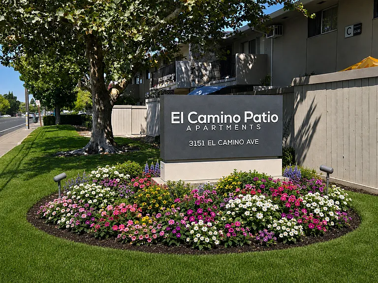 Beautifully landscaped entrance welcomes you home to El Camino Patio Apartments.