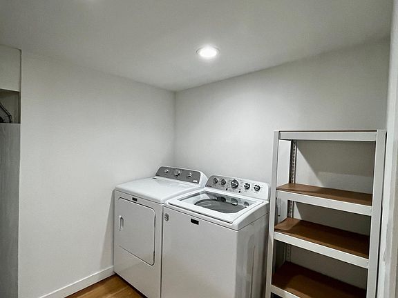 Brand new washer and dryer easily accessible from the kitchen