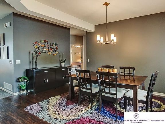Beautiful wood floors great you as you enter into the formal or not so formal Dining Room.