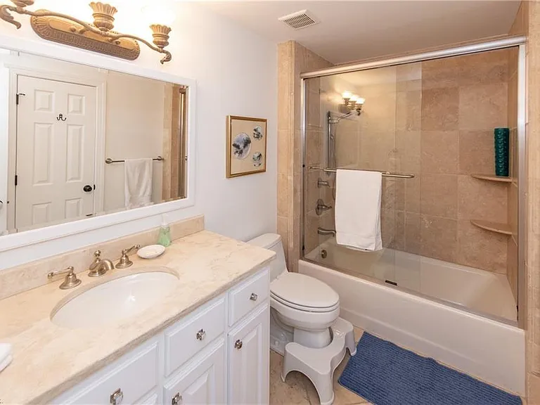 Shared full bath for the middle 2 X twin bed and king size bedroom with bath and shower.