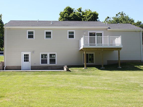 Back of House with Large Concrete Patio and Trex Deck