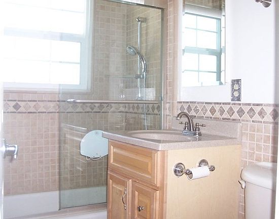 Upgraded bathroom with gorgeous tile work.