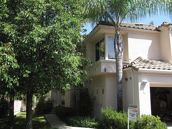 Front of house with garage open