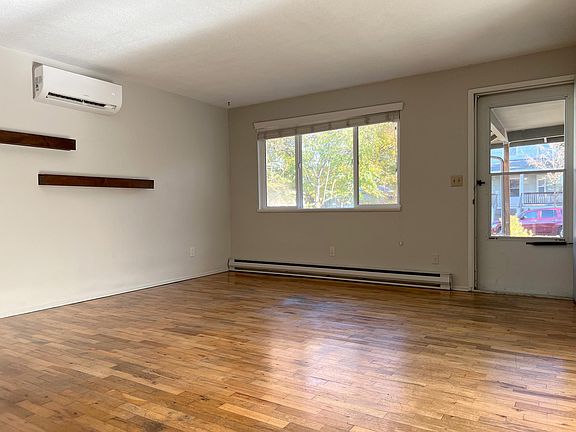 Living room. Front door includes screen door