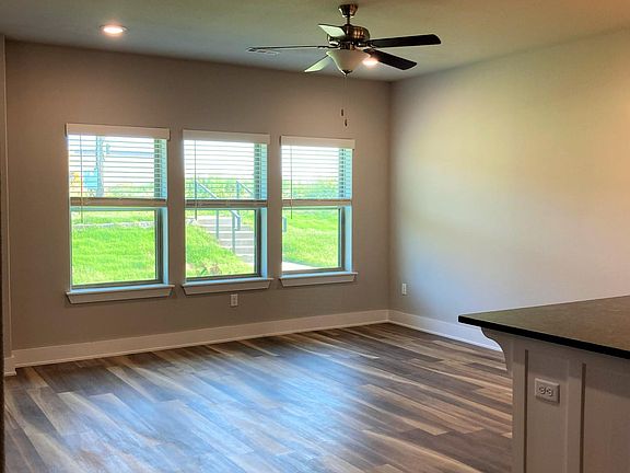 large open concept living area adjacent to kitchen