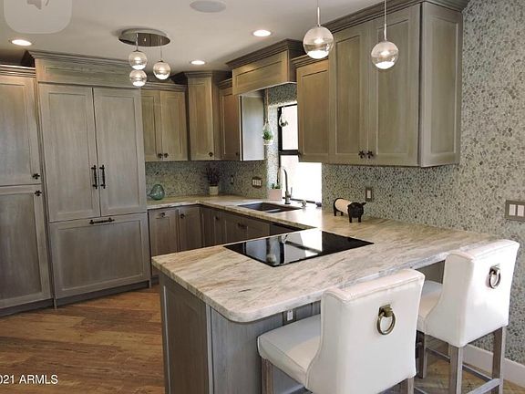 Kitchen looks out to private enclosed patio