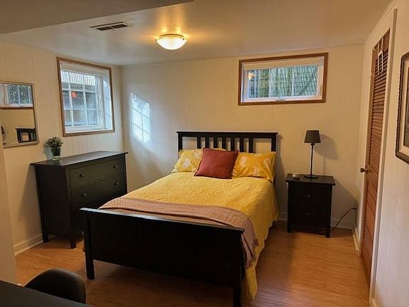 Large bedroom with full (double) bed and large walk-in closet. Fully furnished with bedroom linens.