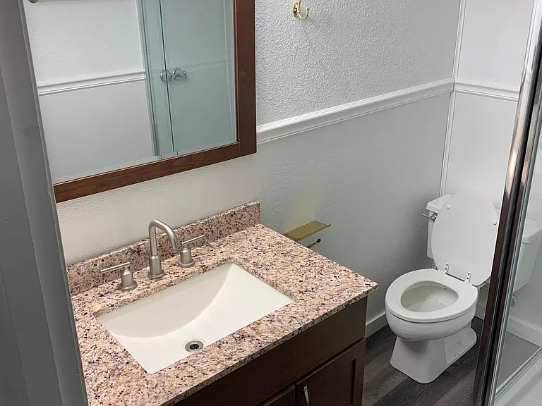 All New flooring, Vanity New, and Shower New.