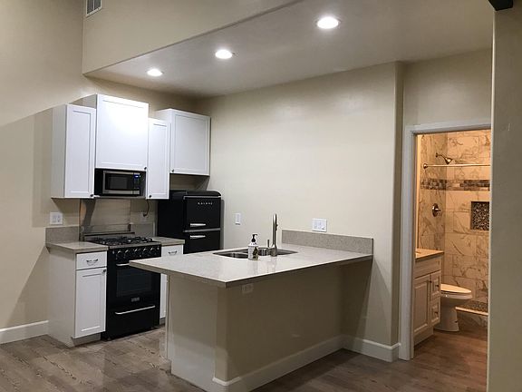 Kitchen and Bath with lights on