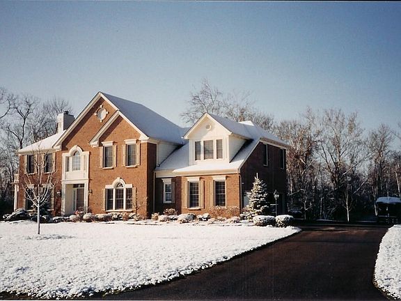 Exterior corner lot side entry drive and 3 car garage