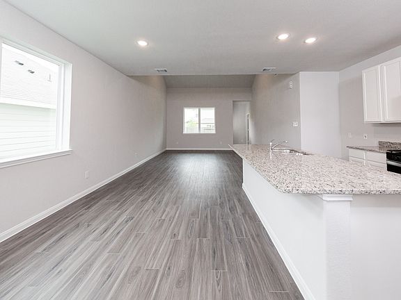 Kitchen to Dining Area and Family Room