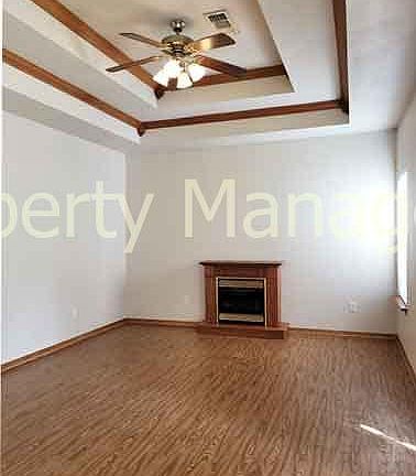 Gas fireplace and ceiling fan in the living room
