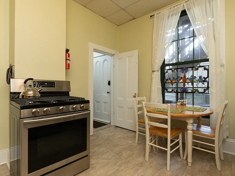 Eat-in table for 3, door with keypad lock.