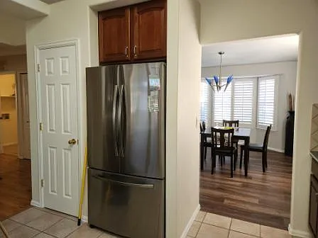 view from kitchen looking into larger dinning room.