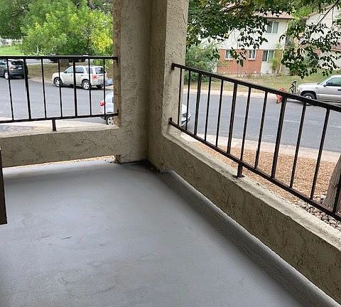 Enjoy serene mornings on this charming balcony with a view of lush greenery. Enjoy serene mornings on this charming balcony with a view of lush greenery.
