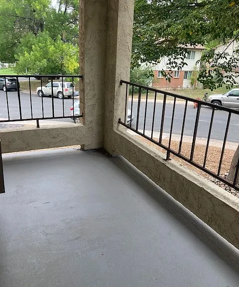 Enjoy serene mornings on this charming balcony with a view of lush greenery. Enjoy serene mornings on this charming balcony with a view of lush greenery.