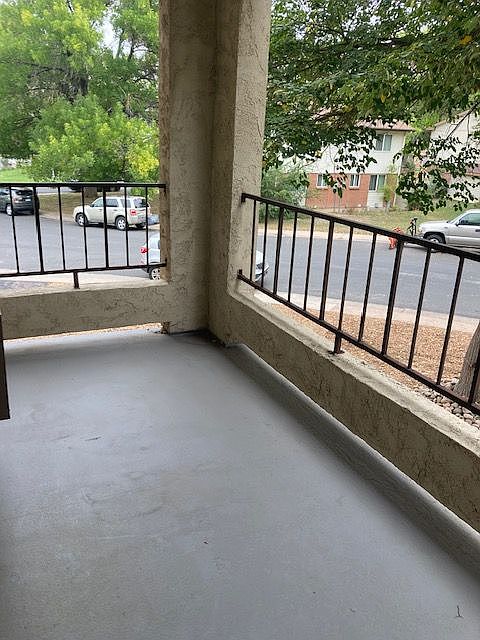 Enjoy serene mornings on this charming balcony with a view of lush greenery. Enjoy serene mornings on this charming balcony with a view of lush greenery.