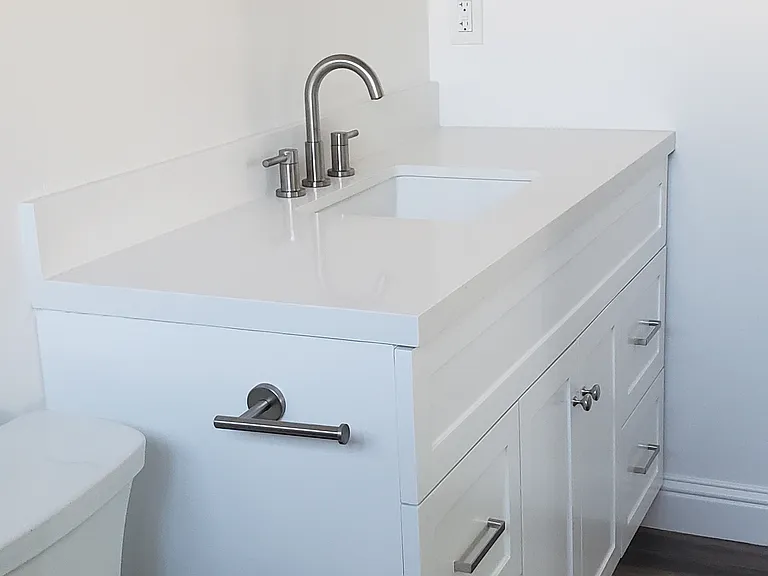 Master bathroom has new: hardware, recessed & vanity lighting, cabinet, toilet and flooring throughout.