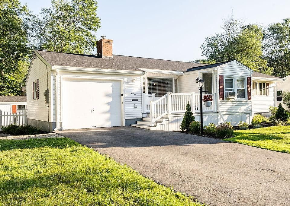 One car garage with garage door opener provides convenient entry to the house. Driveway has been doubled so that two cars can be side by side.