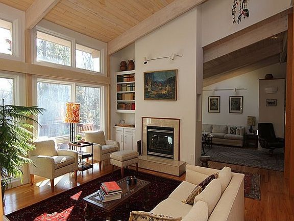 Double sided fireplace looking towards living room and family room