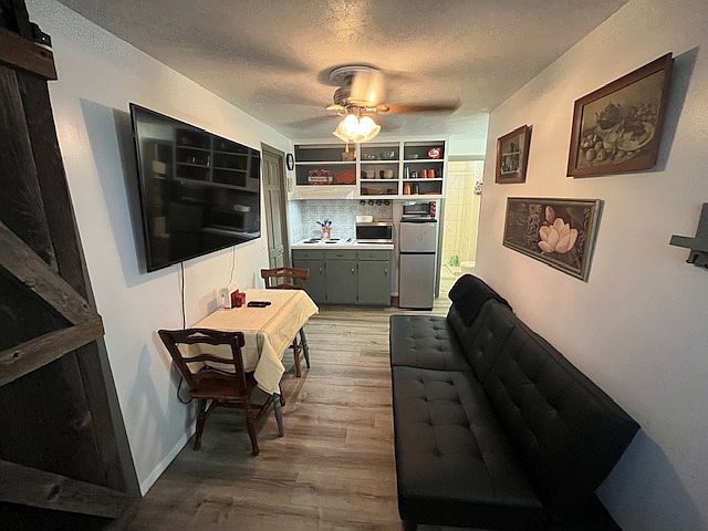 Nice 3 in one kitchen, dining, living room space also has a futon for an occasional guest.