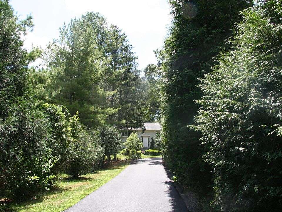 Winding driveway leads to Apt. 58B nestled in a private interior lot, less than a mile from the Guilford Green & I-95.