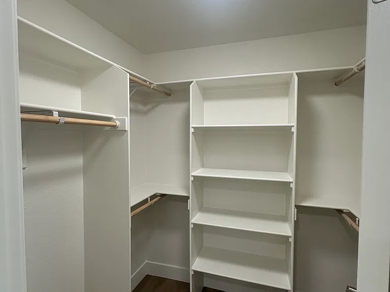Primary bedroom walk-in closet