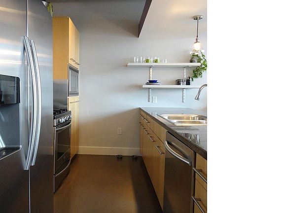 Well planned kitchen open to eating area and adjacent to a wall of windows, cook with a view of beau