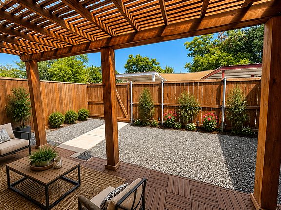 Patio with trellis cover and totally fenced backyard!