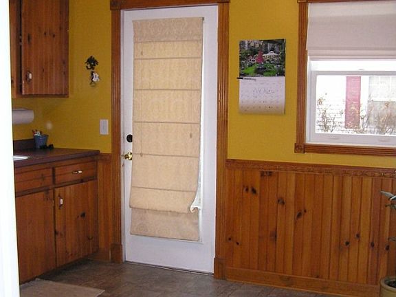 Kitchen view w/side entry door