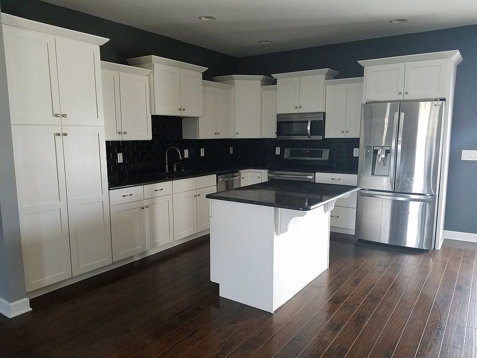 Black subway tile in kitchen