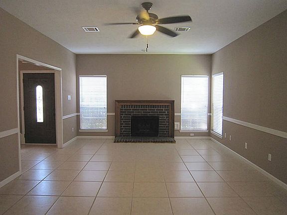 Spacious family room features beautiful 18 inch tile flooring