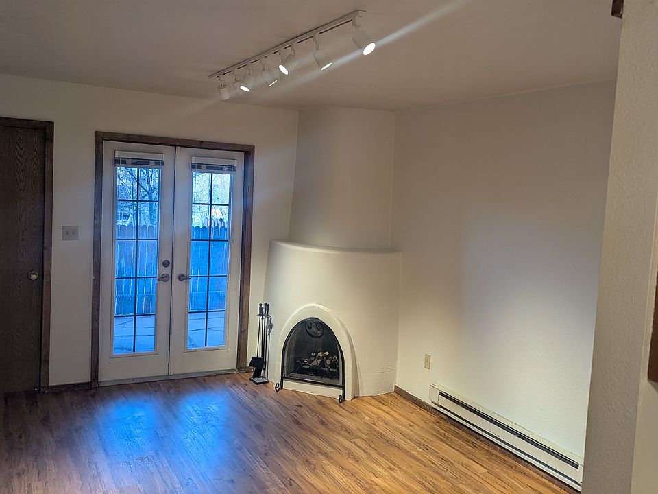 Living room with track lighting and new floor