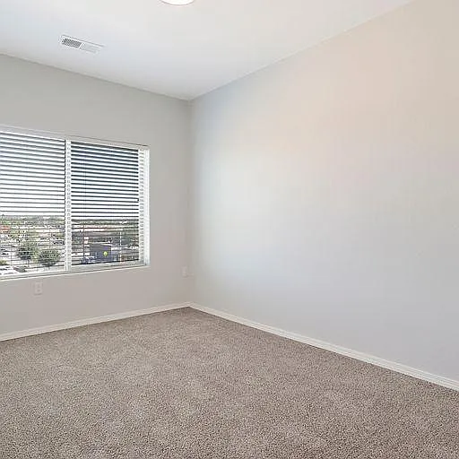 Bedrooms in some units have cozy carpeting.