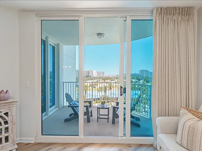 Beautiful glass sliding doors leading out to your private balcony overlooking the pool & ocean views. You can often see waves and boats!