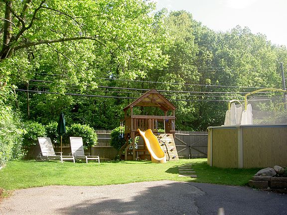 FENCED BACK YARD W/POOL
