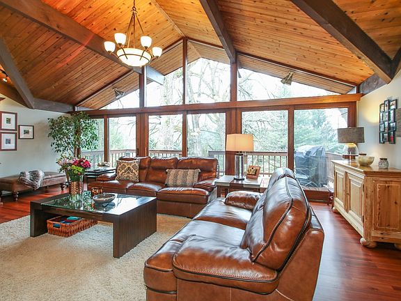 with a wall of windows looking out on nature