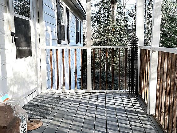 Front porch has a swing.